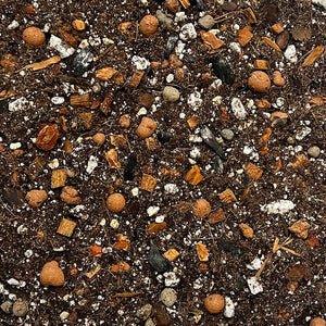 Closeup of Optimize Organics Tropical Chunky Mix—open, airy texture perfect for drainage and pot-bottom layering.